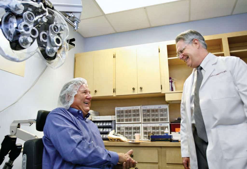Dr. Paul V. Minotty Laughs with Patient