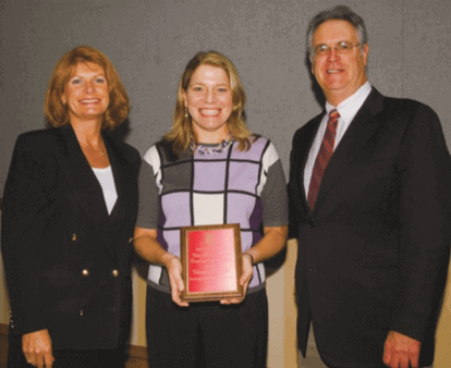 Dr. Paul V. Minotty Presents Award