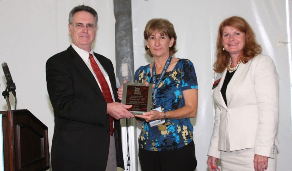 Dr. Paul V. Minotty Presents Award